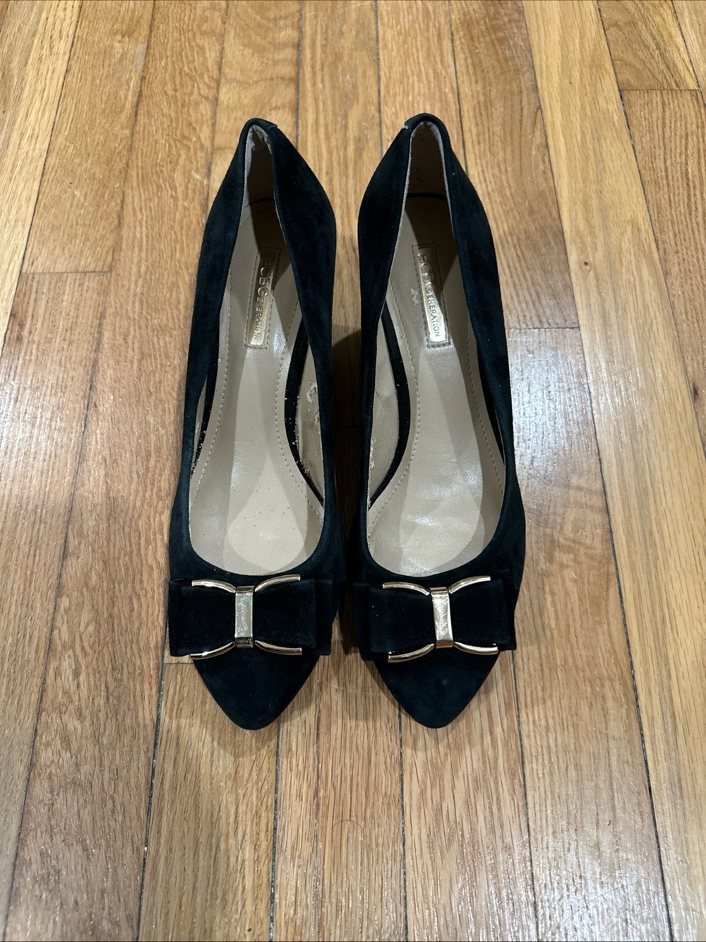 BCBGeneration Black Suede Pointed-Toe Pumps with Gold Bow